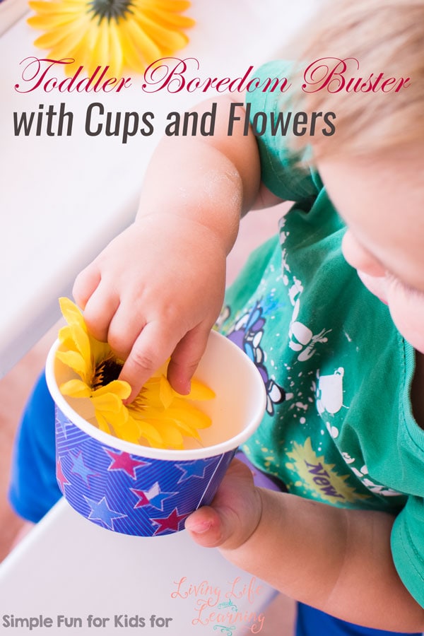 Set up a quick invitation to play to keep your toddler busy: My son had a lot of fun with this Toddler Boredom Buster with Cups and Flowers!