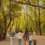 A family walking through the woods