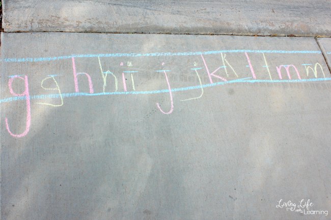 In this post, we will share with you some awesome early writing ideas using sidewalk chalk! My daughter enjoyed not only reviewing her alphabet letter names and sounds, but she also loved practicing writing the letters.