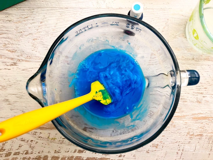 mix borax, glue and food coloring to make slime