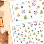 Three Camping I Spy Printables on a table