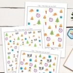 Three Camping I Spy Printables on a table