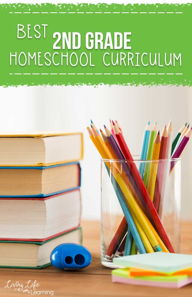 homeschool curriculum stacked on desk with pencil crayons