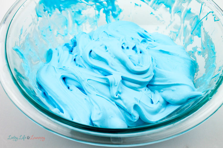 Blue fluffy slime mixed up in a bowl ready for kneading