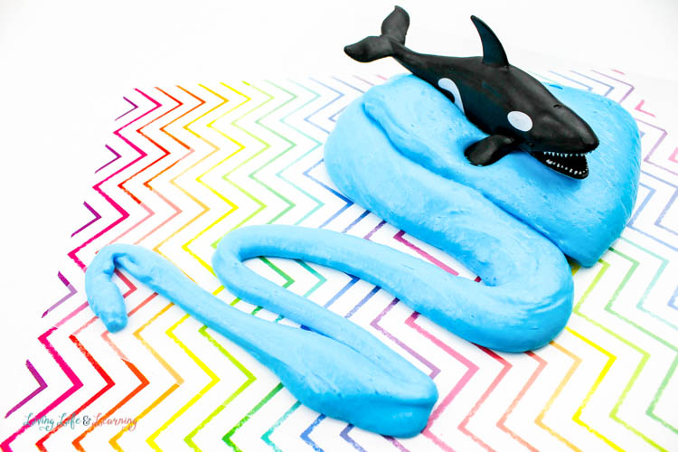 Orca whale on blue fluffy slime that looks like water