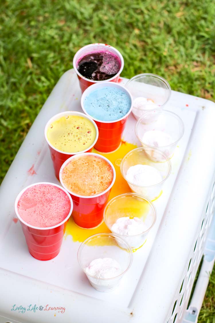 Get ready for messy science with this rainbow Mentos and soda pop experiment! 