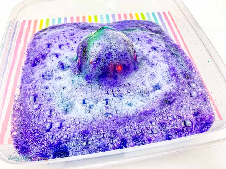 Colorful fizzy eruption of this fun apple volcano science experiment.
