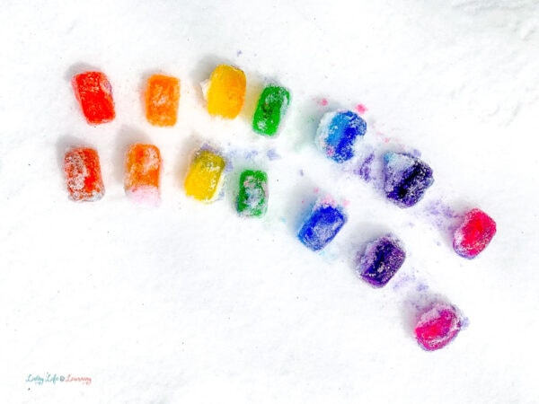 colorful ice cubes on top of white snow