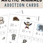 three arctic animals addition cards placed on a table