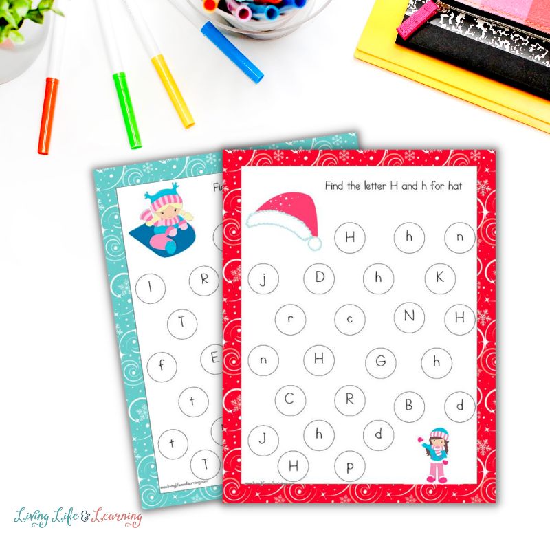 Two Winter Letter Find Worksheets are overlapping, surrounded by colorful stationery.