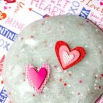 Valentine's Day Slime with two paper hearts placed on top