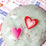 Valentine's Day Slime with two paper hearts placed on top