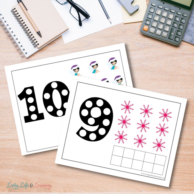 Two overlapped Winter Fairies Counting Mat worksheets on a mockup table. Worksheets contain numbers 10 and 9 with 10 fairies and 9 pink snowflakes.