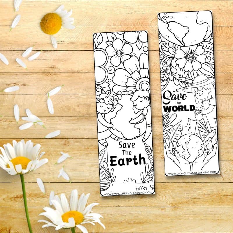 There are two Printable Earth Day Bookmarks on a table.