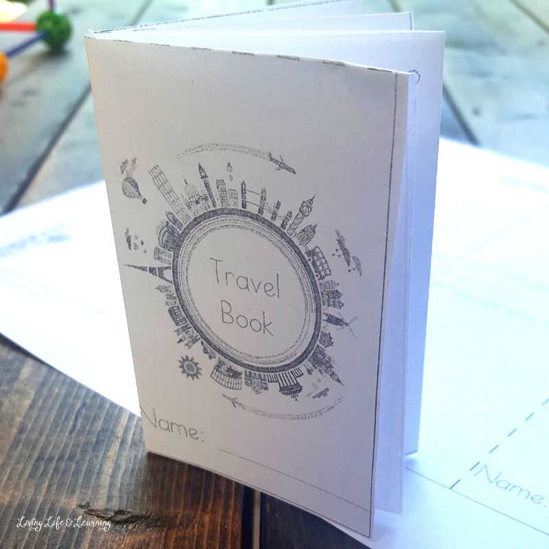 There is a Travel Mini Book for Kids placed on a table.