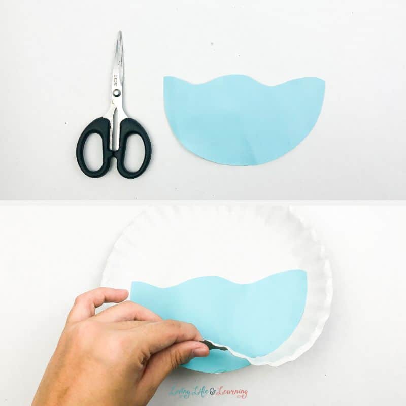 Paper plate and colored paper cutouts for whale paper plate craft