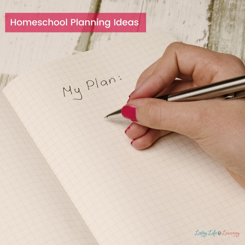 A person is writing a plan on a notebook.