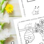 There are two Bee Coloring Pages on a table.