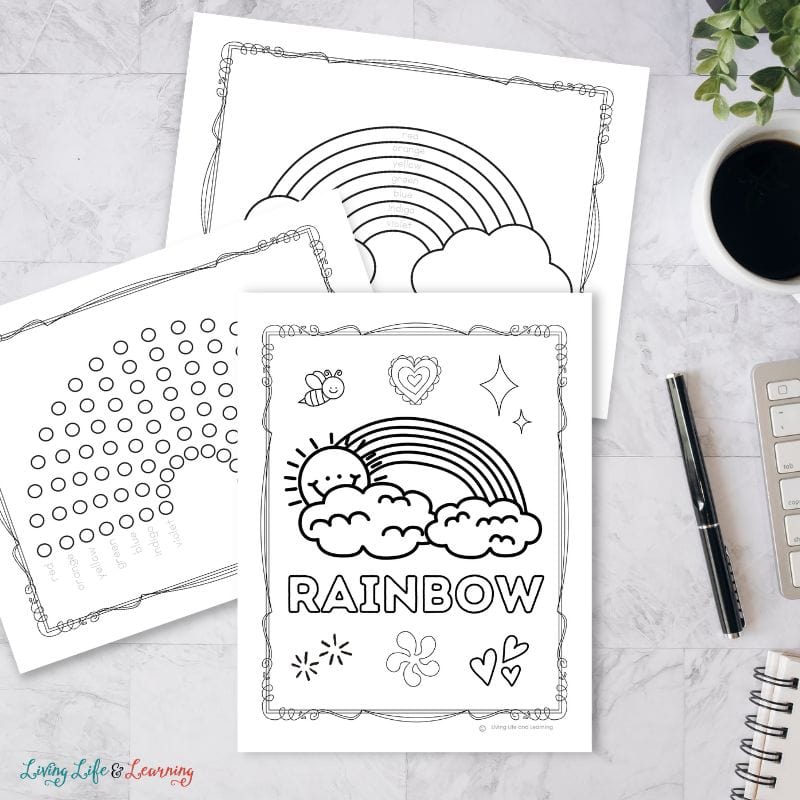 Three Rainbow Coloring Pages on a table
