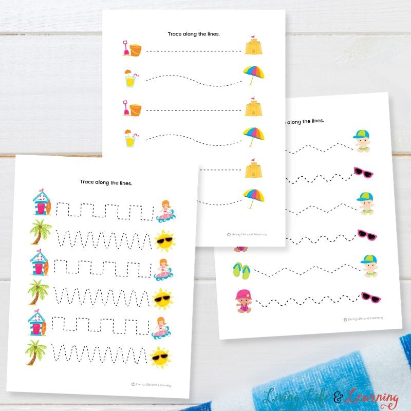 Three Beach Tracing Worksheets on a table