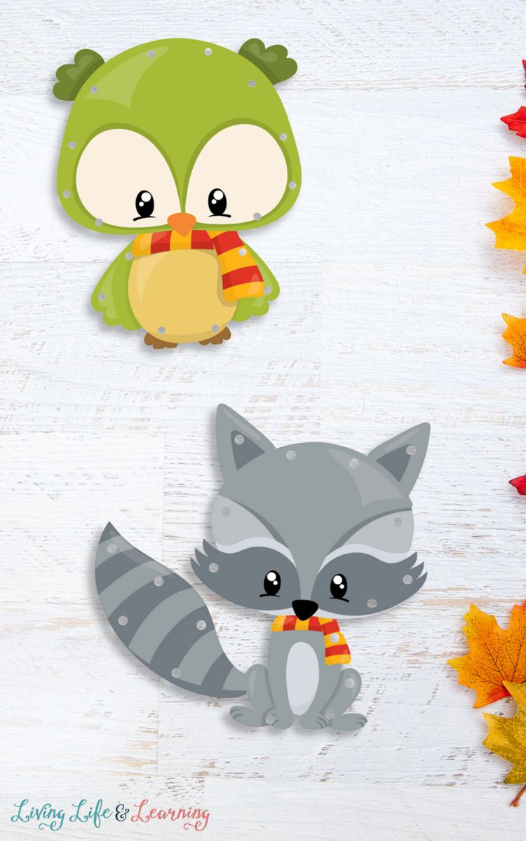 Two Fall Animals Lacing Cards on a table