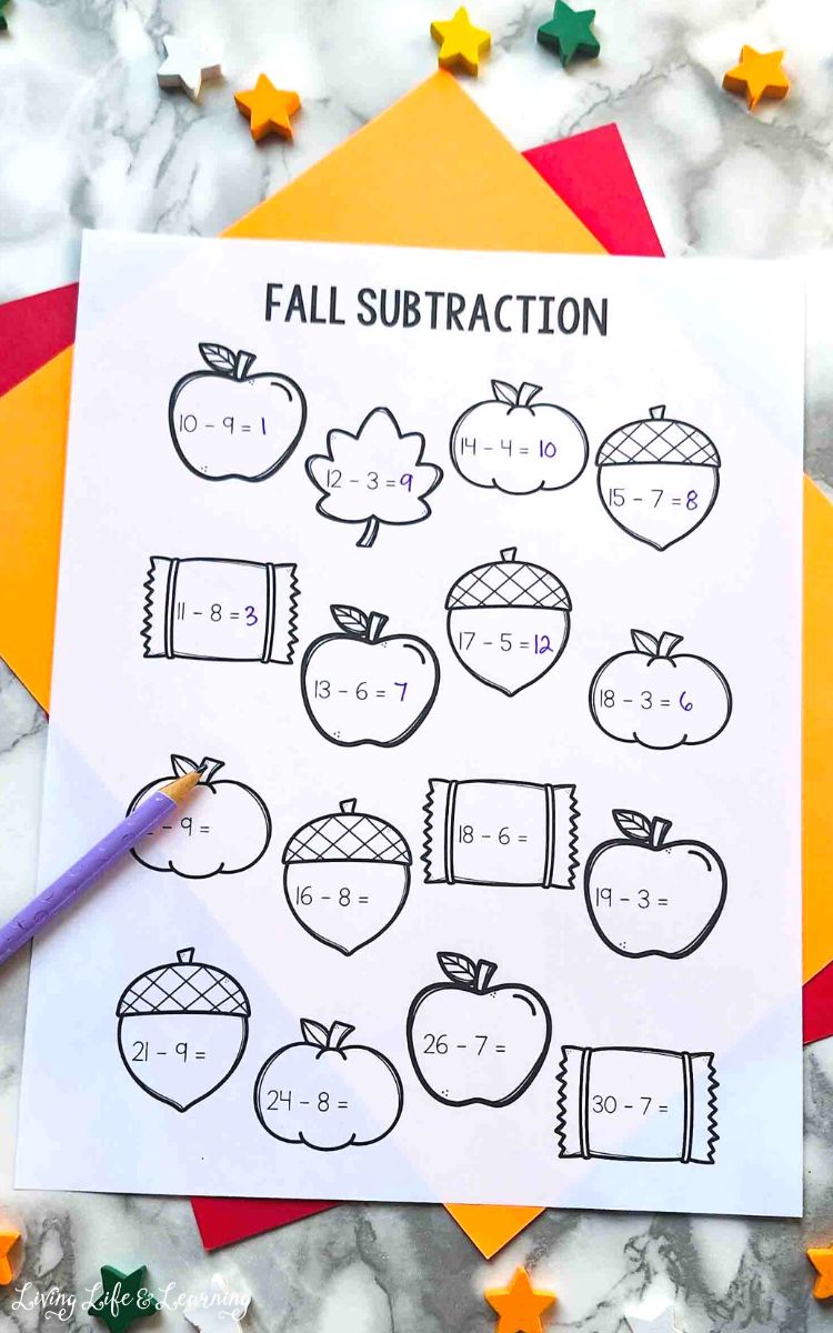 Fall Subtraction Fall Math Worksheets on a table