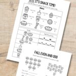 Two Fall Math Worksheets on a table