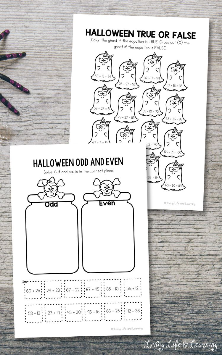 Two Halloween Addition Worksheets on a table