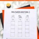 A Halloween Addition Worksheet on a table