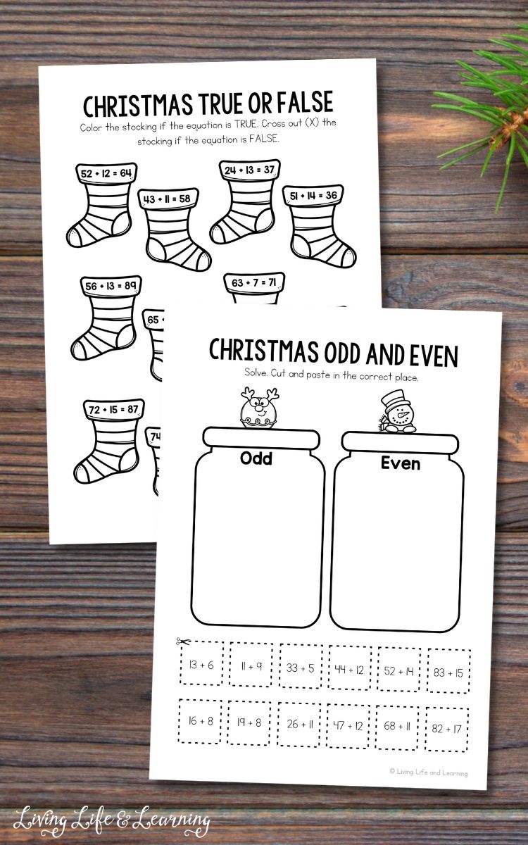 Two Christmas Addition Worksheets on a table
