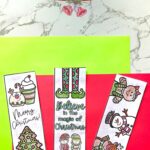 Three Printable Christmas Bookmarks on a table