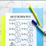 A Winter Addition Worksheet for Kindergarten on a table