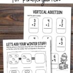 Two Winter Addition Worksheets for Kindergarten on a table