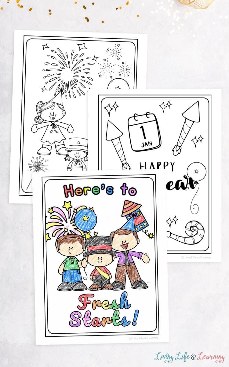 three New Year Coloring Pages on a table