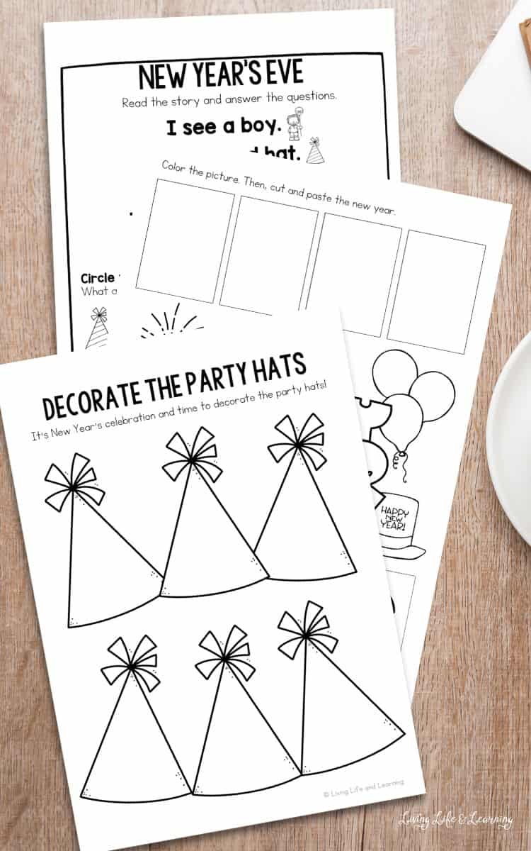 three New Year Worksheets for Kindergarten on a table