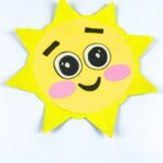 paper plate sun crafr on a table