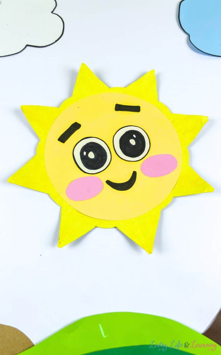 paper plate sun crafr on a table